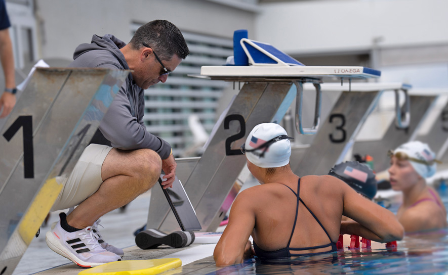 Coach Showing Swimmers Sets