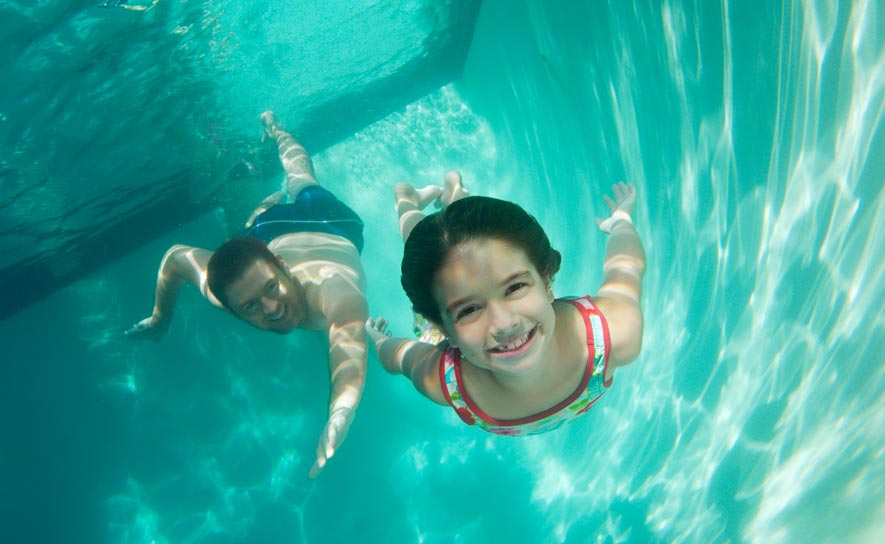 Swimmer and Her Dad Underwater