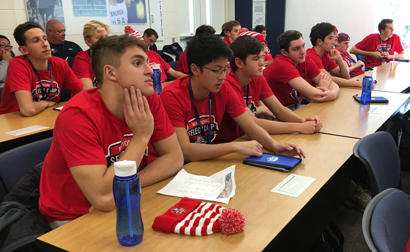 Swimmers at the 2018 National Select Camp listen to a presentation.