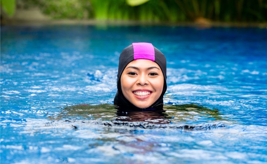 muslim-woman-wearing-burkini-swimwear-at-pool-picture-id547053994
