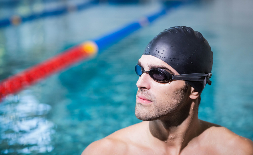 Male athlete with cap and goggles